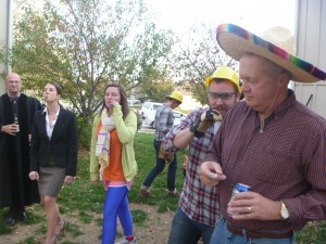 Melissa as a lawyer, Christine as half of double rainbow, James the construction guy and Poppy in a sombrero facing off. 