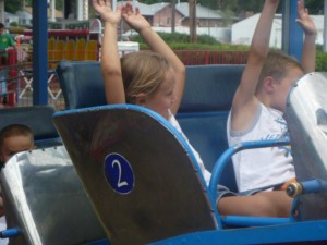 Eli and Andi on the kiddie coaster this year